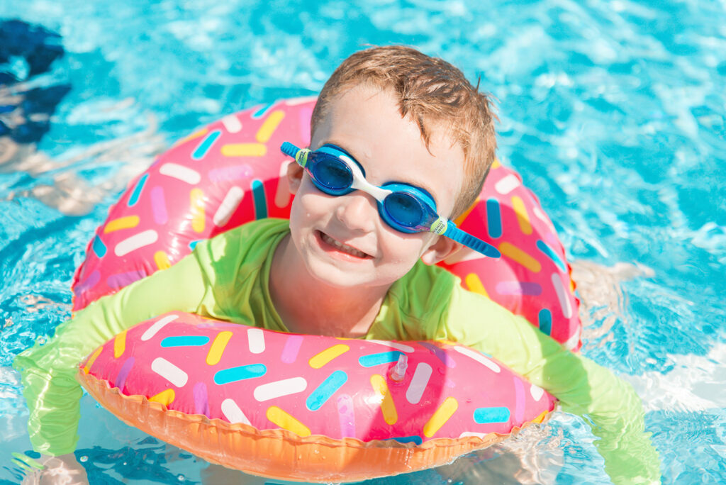 camper swimming with goggles