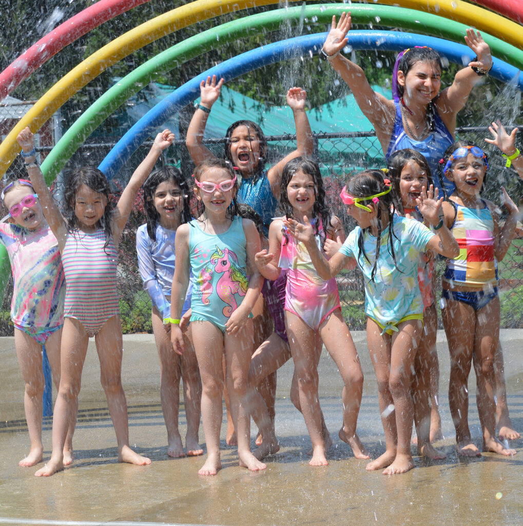 kids using splash park at gate hill day camp